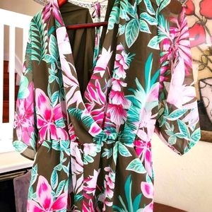Short rompers with pockets. Ties in back.